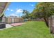 A backyard featuring a brick patio, green lawn, and a storage shed at 2450 3Rd N Ave, St Petersburg, FL 33713