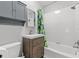Clean bathroom featuring white tiled walls, a modern vanity, and a shower-tub combination at 2450 3Rd N Ave, St Petersburg, FL 33713