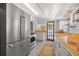 Updated kitchen featuring stainless steel appliances, butcher block countertops, and ample storage at 2450 3Rd N Ave, St Petersburg, FL 33713