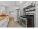 Functional kitchen with stainless steel appliances, and tile flooring at 2450 3Rd N Ave, St Petersburg, FL 33713
