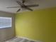 Bedroom featuring light vinyl floors, window with blinds, and ceiling fan at 250 Rosery Nw Rd # 295, Largo, FL 33770