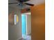 Hallway with orange accent wall leading to bathroom with blue accent wall and vinyl flooring at 250 Rosery Nw Rd # 295, Largo, FL 33770