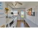 Community laundry room featuring coin operated laundry machines and a bench at 250 Rosery Nw Rd # 295, Largo, FL 33770