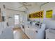 Well-lit laundry room featuring multiple modern machines and convenient utility sink at 250 Rosery Nw Rd # 295, Largo, FL 33770