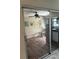 Open concept living room featuring vinyl floors and access to kitchen area at 250 Rosery Nw Rd # 295, Largo, FL 33770