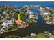 Gorgeous waterfront property with a private boat dock, pool, lush landscaping, and easy access to the bay at 2512 S Dundee St, Tampa, FL 33629