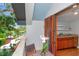 Balcony featuring outdoor seating, garden views, and a kitchenette through double doors at 2512 S Dundee St, Tampa, FL 33629