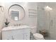 Bathroom features white vanity with marble countertop and glass enclosed shower at 2512 S Dundee St, Tampa, FL 33629