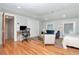 Well-lit bedroom with modern desk, light walls and hardwood floors at 2512 S Dundee St, Tampa, FL 33629