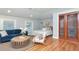 Bright bedroom featuring hardwood floors, blue sofa and natural lighting at 2512 S Dundee St, Tampa, FL 33629