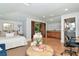Bedroom featuring hardwood floors, an ensuite bathroom, kitchenette, and balcony with views at 2512 S Dundee St, Tampa, FL 33629