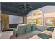 Home theater featuring a large screen, projector, reclining seating and soundproofing at 2512 S Dundee St, Tampa, FL 33629