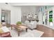 Open-concept living room flows into a bright, modern kitchen with stainless steel appliances and ample counter space at 2512 S Dundee St, Tampa, FL 33629