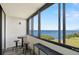 Screened balcony features high top table and seating, with stunning views of the water and green space at 2616 Cove Cay Dr # 803, Clearwater, FL 33760
