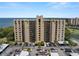 Condominium building showing parking spaces with covered parking with view of Tampa Bay at 2616 Cove Cay Dr # 803, Clearwater, FL 33760