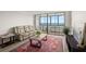 Welcoming living area featuring a sofa, coffee table, and large windows with a scenic water view at 2616 Cove Cay Dr # 803, Clearwater, FL 33760