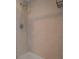 Close-up of a walk-in shower with sleek fixtures, neutral tile, and modern shelving for toiletries at 2616 Cove Cay Dr # 803, Clearwater, FL 33760