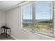 A bright room featuring a scenic window view overlooking the serene waterway and lush green landscape at 2616 Cove Cay Dr # 803, Clearwater, FL 33760