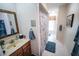 Bathroom boasting a well-lit vanity and a framed mirror at 2780 E Sam Allen Rd, Plant City, FL 33565