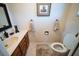 Half bathroom features a dark-wood vanity, marble countertop, and ceramic-tile flooring at 2780 E Sam Allen Rd, Plant City, FL 33565