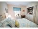 Inviting bedroom featuring a washer and dryer, a window with natural light, and closet space at 2780 E Sam Allen Rd, Plant City, FL 33565