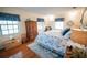 Charming bedroom with a wooden armoire, light walls, and blue curtains for a relaxing space at 2780 E Sam Allen Rd, Plant City, FL 33565