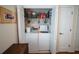 Convenient laundry closet featuring a washer and dryer with storage space at 2780 E Sam Allen Rd, Plant City, FL 33565