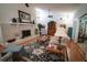 Spacious living room featuring a fireplace, hardwood floors, and a ceiling fan at 2780 E Sam Allen Rd, Plant City, FL 33565