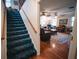 Welcoming living room view shows a staircase, hardwood floors, seating, and ceiling fans at 2780 E Sam Allen Rd, Plant City, FL 33565