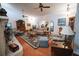 Spacious living room featuring hardwood floors, ceiling fans, and sliding glass doors at 2780 E Sam Allen Rd, Plant City, FL 33565