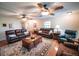 Comfortable living room featuring ceiling fans, hardwood floors, and two sofas at 2780 E Sam Allen Rd, Plant City, FL 33565