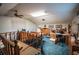 Spacious home office with wood accents, built-in cabinets, blue carpet, and multiple desks at 2780 E Sam Allen Rd, Plant City, FL 33565