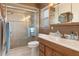 Well-lit bathroom featuring a glass enclosed shower, bright vanity, and modern fixtures at 31076 Castle Ridge Drive, Brooksville, FL 34602
