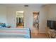Bright bedroom featuring doorways to a walk-in closet and en suite bathroom at 31076 Castle Ridge Drive, Brooksville, FL 34602