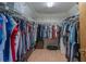 Walk-in closet with built-in shelving and ample storage space for clothing and accessories at 31076 Castle Ridge Drive, Brooksville, FL 34602