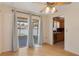 Cozy dining area featuring sliding glass doors to screened patio and view to the adjacent kitchen at 31076 Castle Ridge Drive, Brooksville, FL 34602