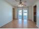 Bright dining room features hardwood floors, ceiling fan, and sliding glass doors to the patio at 31076 Castle Ridge Drive, Brooksville, FL 34602