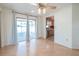 Bright dining room features hardwood floors, ceiling fan, and sliding glass doors to the patio at 31076 Castle Ridge Drive, Brooksville, FL 34602