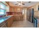 Functional kitchen featuring stainless steel appliances and ample wooden cabinetry at 31076 Castle Ridge Drive, Brooksville, FL 34602