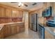 Functional kitchen featuring stainless steel appliances and ample wooden cabinetry at 31076 Castle Ridge Drive, Brooksville, FL 34602