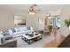 Living room featuring a plush sofa, stylish decor, and a dining area at 31076 Castle Ridge Drive, Brooksville, FL 34602