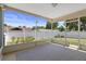 Inviting screened patio for outdoor relaxation, perfect for enjoying the fresh air and green scenery at 31076 Castle Ridge Drive, Brooksville, FL 34602
