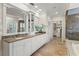 Spacious bathroom features double sinks, granite countertops, and a large mirror, offering comfort and style at 321 Brightwaters Ne Blvd, St Petersburg, FL 33704