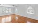 Spacious bedroom with large windows and hardwood floors, ideal for relaxation and comfort at 321 Brightwaters Ne Blvd, St Petersburg, FL 33704