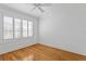 Sunlit bedroom with hardwood flooring and plantation shutters at 321 Brightwaters Ne Blvd, St Petersburg, FL 33704
