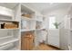 Organized walk-in closet with ample shelving and hanging space for efficient storage and accessibility at 321 Brightwaters Ne Blvd, St Petersburg, FL 33704