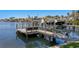 Private dock with boat lift featuring waterfront views and wooden construction at 321 Brightwaters Ne Blvd, St Petersburg, FL 33704