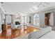Spacious main bedroom boasts fireplace, arched windows, and hardwood floors, providing a luxurious retreat at 321 Brightwaters Ne Blvd, St Petersburg, FL 33704