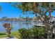 Picturesque waterfront view featuring lush landscaping, tranquil waters, and luxurious homes with boat docks at 321 Brightwaters Ne Blvd, St Petersburg, FL 33704