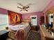 Bedroom featuring a bed, a dresser and a fan overhead at 32111 Brookstone Dr, Wesley Chapel, FL 33545